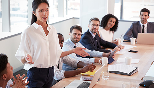 business team meeting in modern office with presenter and audience discussing ideas and strategies for achieving success in six steps